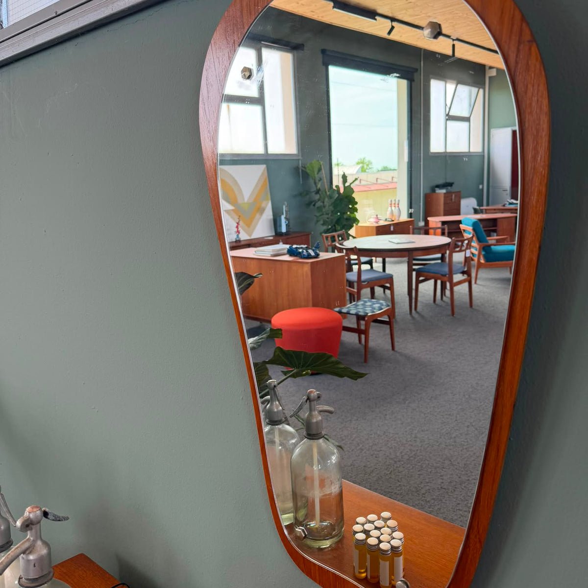 Organic shaped teak wood mirror